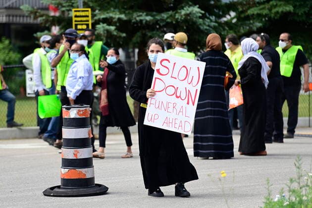 June 12, 2021, London, on, Canada: A woman holds a sign at a funeral for the four Muslim family members killed in a deadly vehicle attack, in London, Ont., on Saturday, June 12, 2021. Talat Afzaal, 74, her son Salman Afzaal, 46, his wife Madiha Salman, 44, and their 15-year-old daughter Yumna Salman all died last Sunday night while out for a walk after a man in a truck drove them down in what police have called a premeditated attack because they were Muslim. London Canada - ZUMAc35_ 20210612_zaf_c35_014 Copyright: xFrankxGunnx
