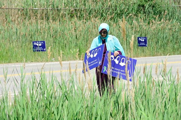 June 12, 2021, London, on, Canada: A woman holds a sign at a funeral for the four Muslim family members killed in a deadly vehicle attack, in London, Ont., on Saturday, June 12, 2021. Talat Afzaal, 74, her son Salman Afzaal, 46, his wife Madiha Salman, 44, and their 15-year-old daughter Yumna Salman all died last Sunday night while out for a walk after a man in a truck drove them down in what police have called a premeditated attack because they were Muslim. London Canada - ZUMAc35_ 20210612_zaf_c35_016 Copyright: xFrankxGunnx