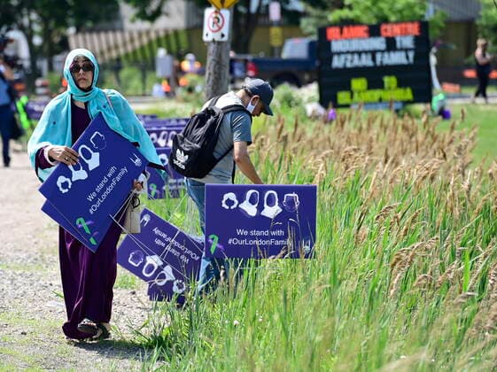 June 12, 2021, London, on, Canada: A woman holds a sign at a funeral for the four Muslim family members killed in a deadly vehicle attack, in London, Ont., on Saturday, June 12, 2021. Talat Afzaal, 74, her son Salman Afzaal, 46, his wife Madiha Salman, 44, and their 15-year-old daughter Yumna Salman all died last Sunday night while out for a walk after a man in a truck drove them down in what police have called a premeditated attack because they were Muslim. London Canada - ZUMAc35_ 20210612_zaf_c35_017 Copyright: xFrankxGunnx
