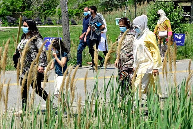 June 12, 2021, London, on, Canada: People start arriving to the funeral for the four Muslim family members killed in a deadly vehicle attack, in London, Ont., on Saturday, June 12, 2021. Talat Afzaal, 74, her son Salman Afzaal, 46, his wife Madiha Salman, 44, and their 15-year-old daughter Yumna Salman all died last Sunday night while out for a walk after a man in a truck drove them down in what police have called a premeditated attack because they were Muslim. London Canada - ZUMAc35_ 20210612_zaf_c35_025 Copyright: xFrankxGunnx