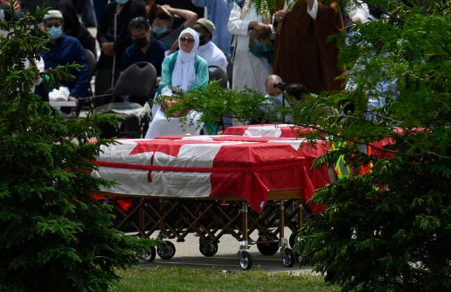 June 12, 2021, London, on, Canada: Four caskets, covered in the Canadian flags, are shown during the funeral for the four Muslim family members killed in a deadly vehicle attack, in London, Ont., on Saturday, June 12, 2021. Talat Afzaal, 74, her son Salman Afzaal, 46, his wife Madiha Salman, 44, and their 15-year-old daughter Yumna Salman all died last Sunday night while out for a walk after a man in a truck drove them down in what police have called a premeditated attack because they were Muslim. London Canada - ZUMAc35_ 20210612_zaf_c35_035 Copyright: xFrankxGunnx