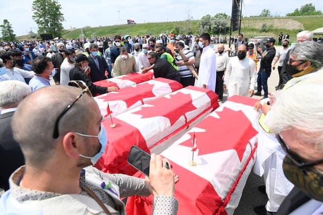 June 12, 2021, London, on, Canada: Caskets draped in Canadian flags arrive at a funeral for the four Muslim family members killed in a deadly vehicle attack, at the Islamic Centre of Southwest Ontario in London, Ont., on Saturday, June 12, 2021. Talat Afzaal, 74, her son Salman Afzaal, 46, his wife Madiha Salman, 44, and their 15-year-old daughter Yumna Salman all died last Sunday night while out for a walk after a man in a truck drove them down in what police have called a premeditated attack because they were Muslim. London Canada - ZUMAc35_ 20210612_zaf_c35_039 Copyright: xNathanxDenettex