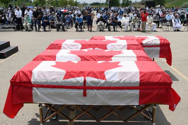 June 12, 2021, London, on, Canada: Caskets draped in Canadian flags are on display at a funeral for the four Muslim family members killed in a deadly vehicle attack, at the Islamic Centre of Southwest Ontario in London, Ont., on Saturday, June 12, 2021. Talat Afzaal, 74, her son Salman Afzaal, 46, his wife Madiha Salman, 44, and their 15-year-old daughter Yumna Salman all died last Sunday night while out for a walk after a man in a truck drove them down in what police have called a premeditated attack because they were Muslim. London Canada - ZUMAc35_ 20210612_zaf_c35_040 Copyright: xNathanxDenettex