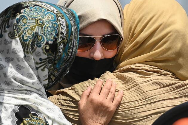 June 12, 2021, London, on, Canada: Family members comfort each other during the funeral service for the four Muslim family members killed in a deadly vehicle attack, at the Islamic Centre of Southwest Ontario in London, Ont., on Saturday, June 12, 2021. Talat Afzaal, 74, her son Salman Afzaal, 46, his wife Madiha Salman, 44, and their 15-year-old daughter Yumna Salman all died last Sunday night while out for a walk after a man in a truck drove them down in what police have called a premeditated attack because they were Muslim. London Canada - ZUMAc35_ 20210612_zaf_c35_051 Copyright: xNathanxDenettex