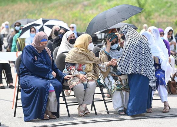 June 12, 2021, London, on, Canada: Immediate family members are greeted at the funeral service for the four Muslim family members killed in a deadly vehicle attack, at the Islamic Centre of Southwest Ontario in London, Ont., on Saturday, June 12, 2021. Talat Afzaal, 74, her son Salman Afzaal, 46, his wife Madiha Salman, 44, and their 15-year-old daughter Yumna Salman all died last Sunday night while out for a walk after a man in a truck drove them down in what police have called a premeditated attack because they were Muslim. London Canada - ZUMAc35_ 20210612_zaf_c35_053 Copyright: xNathanxDenettex