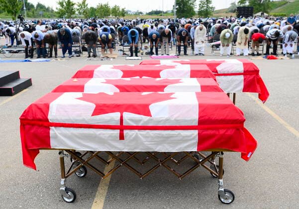 June 12, 2021, London, on, Canada: Thousands pray at the funeral service for the four victims of the deadly vehicle attack on members of the Canadian Muslim community in London, Ont., on Saturday, June 12, 2021.Talat Afzaal, 74, her son Salman Afzaal, 46, his wife Madiha Salman, 44, and their 15-year-old daughter Yumna Salman all died last Sunday night while out for a walk after a man in a truck drove them down in what police have called a premeditated attack because they were Muslim. London Canada - ZUMAc35_ 20210612_zaf_c35_080 Copyright: xNathanxDenettex