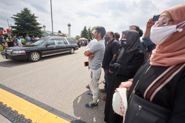 June 12, 2021, London, on, Canada: Mourners watch as the funeral procession leaves the funeral service for the four victims of a deadly vehicle attack, in London, Ont., on Saturday, June 12, 2021. Talat Afzaal, 74, her son Salman Afzaal, 46, his wife Madiha Salman, 44, and their 15-year-old daughter Yumna Salman all died last Sunday night while out for a walk after a man in a truck drove them down in what police have called a premeditated attack because they were Muslim. London Canada - ZUMAc35_ 20210612_zaf_c35_085 Copyright: xGeoffxRobinsx