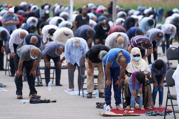 June 12, 2021, London, on, Canada: Thousands of Muslims pray during the funeral service for the four victims of a deadly vehicle attack in London, Ont., on Saturday, June 12, 2021. Talat Afzaal, 74, her son Salman Afzaal, 46, his wife Madiha Salman, 44, and their 15-year-old daughter Yumna Salman all died last Sunday night while out for a walk after a man in a truck drove them down in what police have called a premeditated attack because they were Muslim. London Canada - ZUMAc35_ 20210612_zaf_c35_086 Copyright: xGeoffxRobinsx