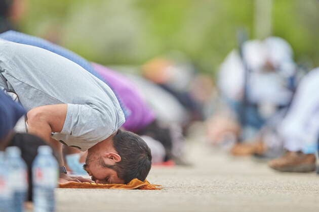 June 12, 2021, London, on, Canada: Muslim men pray during the funeral service for the four victims of a deadly vehicle attack in London, Ont., on Saturday, June 12, 2021. Talat Afzaal, 74, her son Salman Afzaal, 46, his wife Madiha Salman, 44, and their 15-year-old daughter Yumna Salman all died last Sunday night while out for a walk after a man in a truck drove them down in what police have called a premeditated attack because they were Muslim. London Canada - ZUMAc35_ 20210612_zaf_c35_089 Copyright: xGeoffxRobinsx