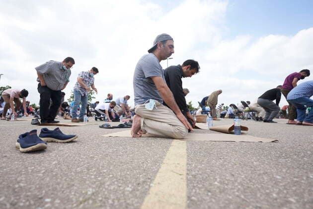 June 12, 2021, London, on, Canada: Muslim men pray during the funeral service for the four victims of a deadly vehicle attack in London, Ont., on Saturday, June 12, 2021. Talat Afzaal, 74, her son Salman Afzaal, 46, his wife Madiha Salman, 44, and their 15-year-old daughter Yumna Salman all died last Sunday night while out for a walk after a man in a truck drove them down in what police have called a premeditated attack because they were Muslim. London Canada - ZUMAc35_ 20210612_zaf_c35_092 Copyright: xGeoffxRobinsx