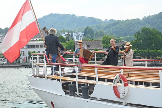 Second of four parts of the event Hausmusikroas , with local folk musicians, on squares of the village Gmunden, in the Upper Austrian Salzkammergut, as part of the Salzka