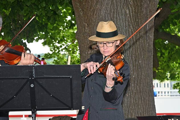 Second of four parts of the event Hausmusikroas , with local folk musicians, on squares of the village Gmunden, in the Upper Austrian Salzkammergut, as part of the Salzkammergut Festiv