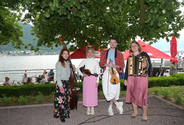 Second of four parts of the event Hausmusikroas , with local folk musicians, on squares of the town of Gmunden,