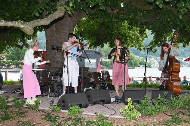 Second of four parts of the event Hausmusikroas , with local folk musicians, on squares of the town of Gmunden,