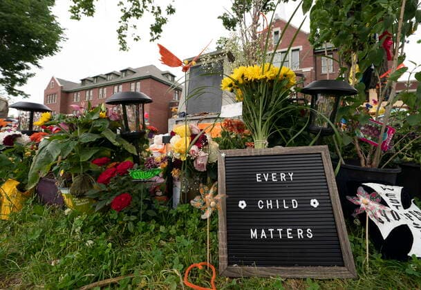 June 13, 2021, Kamloops, BC, Canada: A sign is pictured at a memorial outside the Kamloops Residential School in Kamloops, B.C., Sunday, June, 13, 2021. The remains of 215 children were discovered buried near the former Kamloops Indian Residential School earlier this month. Kamloops Canada  - ZUMAc35_ 20210613_zaf_c35_087 Copyright: xJonathanxHaywardx