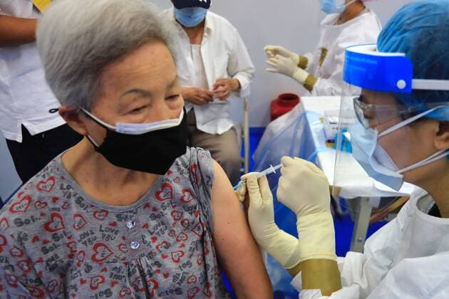 June 15, 2021, New Taipei, New Taipei, Taiwan: An elderly lady gets vaccinated with the Astra Zeneca vaccine, as the authority commences its nationwide vaccination programmes today, following a local Covid-19 outbreak jeopardising the economy and medical systems with a dramatic surge in death toll and infection rates. The donated 1.24 million doses of Astra Zeneca vaccines by Japan are to be jabbed among six priority groups including medical and disease control workers and people working in high-risk conditions, according to Taiwan CECC, as the island struggles to combat the uncurbed outbreak, New Taipei Taiwan - ZUMAs313 20210615_zip_s313_015 Copyright: xDanielxCengxShou-Yix
