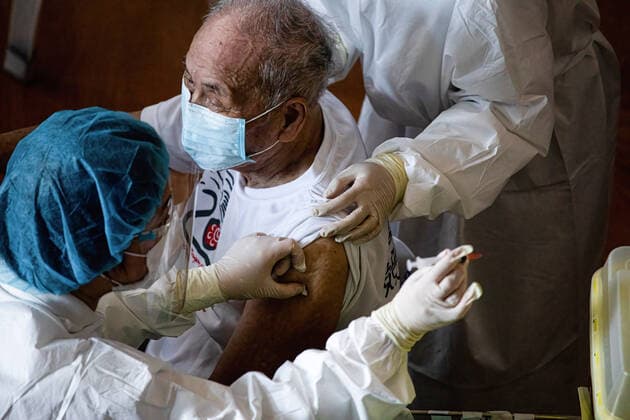 June 15, 2021, Taipei, Taiwan: Health workers administer a dose of AstraZeneca COVID-19 vaccine to an elderly man..Vaccination session for elderly people over 85 years old begins on Tuesday in Taipei, Taiwan on June 15, 2021. Taipei Taiwan - ZUMAs197 20210615_zaa_s197_018 Copyright: xAnnabellexChihx