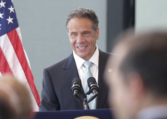 New York Gov. Andrew Cuomo winks when he arrives for his speech where he goes on to make an official announcement that New York State has officially lifted all COVID restrictions and lockdowns at One World Trade Center in New York City on Tuesday, June 15, 2021.  NYP20210615107 JohnxAngelillo