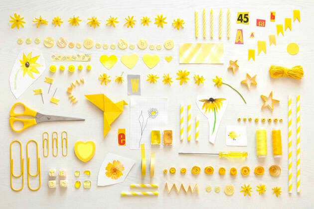 Collection of yellow items including flower heads, sewing items and office supplies property released CMF00888