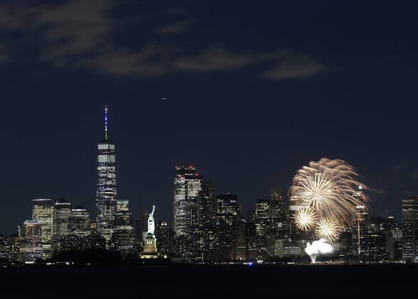 New York City puts on a fireworks show over the Statue Of Liberty and the Manhattan skyline after New York Gov. Andrew Cuomo announces that New York State has officially lifted all COVID restrictions and lockdowns in Bayonne, New Jersey on Tuesday, June 15, 2021.  NYP20210615134 JohnxAngelillo
