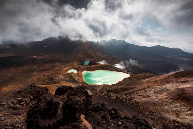New Zealand, Ruapehu District, Clouds over green hot spring in Tongariro National Park WVF01976