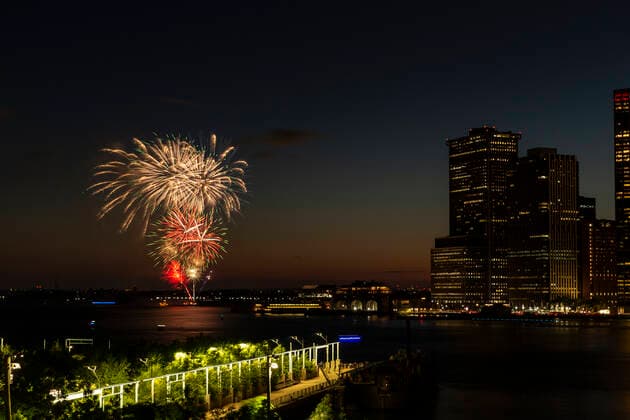 Fireworks display in NYC on the day state lifted pandemic restrictions Fireworks lit evening skies in celebration of reaching 70 percent of New York adults receiving their first dose of the COVID-19 vaccine on New York Harbor. Governor Andrew Cuomo ordered fireworks display to celebrate lifting restriction and to recognize essential workers for their hard work and to remember those we lost. New York New York United States Copyright: LevxRadin