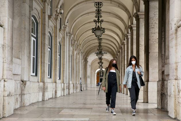 (210619) -- LISBON, June 19, 2021 -- People wearing face masks walk in downtown Lisbon, Portugal, June 18, 2021. The Portuguese government announced on Thursday that the entire Metropolitan Area of Lisbon (AML) will be in isolation on weekends, from 3 p.m. on Friday to 6 a.m. on next Monday, in a bid to contain the increase in cases of COVID-19 in the country s capital. (Photo by Xinhua) PORTUGAL-LISBON-COVID-19-ISOLATION PedroxFiuza 