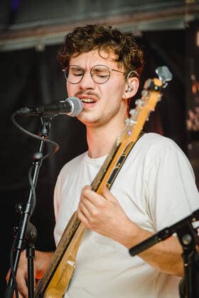 Daens live in Bern, Switzerland Bern, Switzerland. 18th, June 2021. The Swiss band Daens performs a live garden concert at Bierh?beli in Bern. Here bass player Tom Horat is seen live on stage. Bern Switzerland  Copyright: xGonzalesxPhoto TilmanxJentzschx
