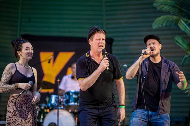 The Dresden Reggae and Ska Band Yellow Umbrella on the picture Veronika Kralacek, Jens Strohschnieder and Longfingah during their performance at the concert place Weißer Hirsch in Dresden