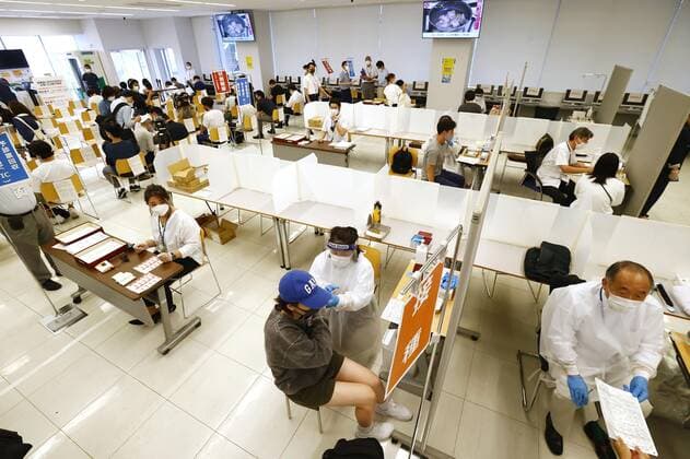 COVID-19 vaccinations begin at Japanese universities Students at Nippon Sport Science University receive COVID-19 vaccinations at its campus in Tokyo s Setagaya Ward on June 21, 2021. COVID-19 mass vaccinations at some Japanese universities for their students and employees began the same day. 