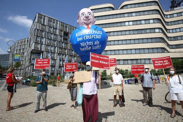 In front of the EUREF Campus in Berlin on Monday 21 06 2021, protesters raised a five-meter-high Laschet balloon Climate protection at CDU CSU Nothing but hot air is emblazoned on the inflatable figure at chest level The activists want to make it known that Chancellor candidate Armin Laschet is not very serious about climate Copyright: epd-bild JuergenxBlume EDITORIAL USE ONLY