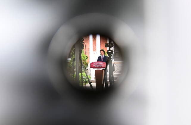 June 25, 2021, Ottawa, on, Canada: Prime Minister Justin Trudeau is photographed through a hole in a tarp tent as he holds a press conference at Rideau Cottage in Ottawa on Friday, June 25, 2021. Ottawa Canada  - ZUMAc35_ 20210625_zaf_c35_022 Copyright: xSeanxKilpatrickx