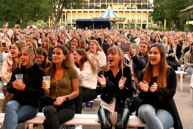 An enthusiastic audience for Danish Christopher who plays up to Havefest paa Plaenen in Tivoli on Friday 25 June 2021 with seated audience divided into two sections Havefest replaces Fredagsrock, which has been canceled due to the Covid 19 Corona crisis, Copenhagen  Copyright: TorbenxChristensen TorbenxChristensenx COP333 spdk20210626-010300-L