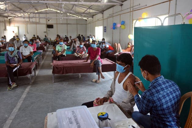 New Delhi, India - June 25, 2021: Homeless people being inoculated against Covid-19 during a vaccination drive at a shelter, near Kashmere Gate, in New Delhi, India, on Friday, June 25, 2021. (Photo by Amal KS Hindustan Times) Covid Vaccination Camp For Homeless