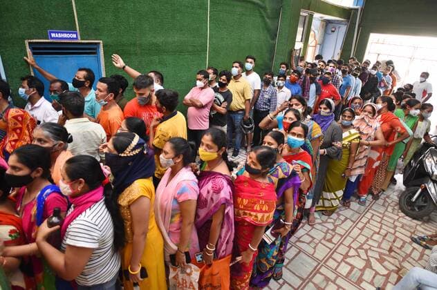 GURUGRAM, INDIA - JUNE 25: People, not adhering to social distancing norms, wait in queues to receive Covid-19 dose, at a vaccination centre, on June 25, 2021 in Gurugram, India. (Photo by Vipin Kumar Hindustan Times) COVID-19 Vaccination Drive