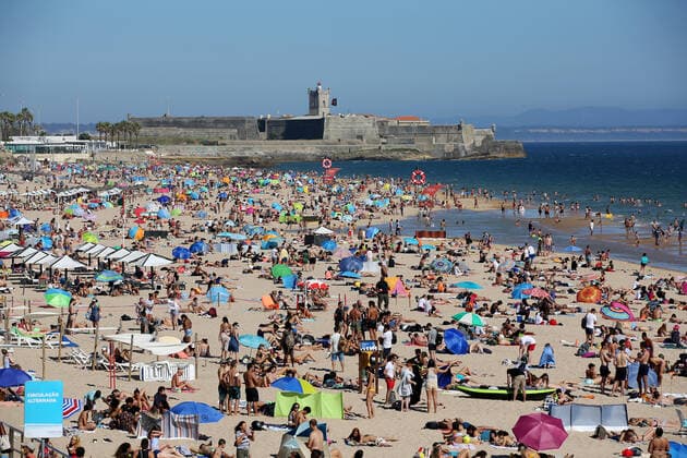 June 26, 2021, Lisbon, Portugal: Beachgoers enjoy a summer day at the Carcavelos beach as the COVID-19 coronavirus pandemic continues, in Cascais, near Lisbon, Portugal, on June 26, 2021. Lisbon Portugal - ZUMAf123 20210626_zap_f123_005 Copyright: xPedroxFiuzax