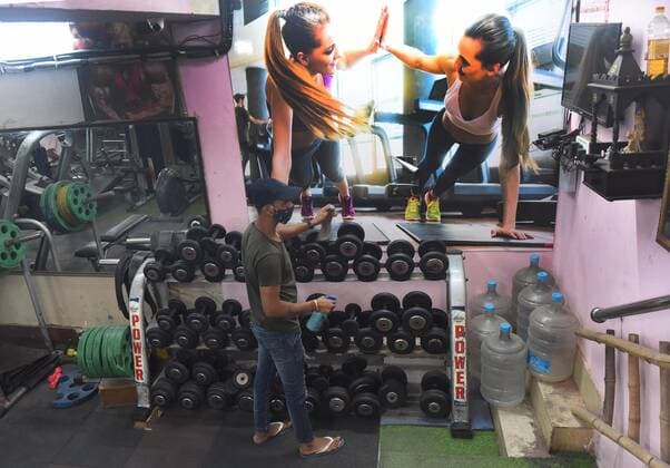 NEW DELHI, INDIA ? JUNE 27: The Body Gym staff clean and sanitized fitness machines to prepare open after Delhi government allow unlock, on June 27, 2021 in New Delhi, India. Gyms and yoga centres have been allowed to reopen in Delhi from Monday at 50% capacity, an official government order said. Banquet halls, marriage halls, and hotels have also been permitted to host weddings, but the number of guests has been capped at 50, the order said. (Photo by Mohd Zakir Hindustan Times ) Delhi Unlock 5: Gyms, Banquet Halls, Hotels To Open From Monday