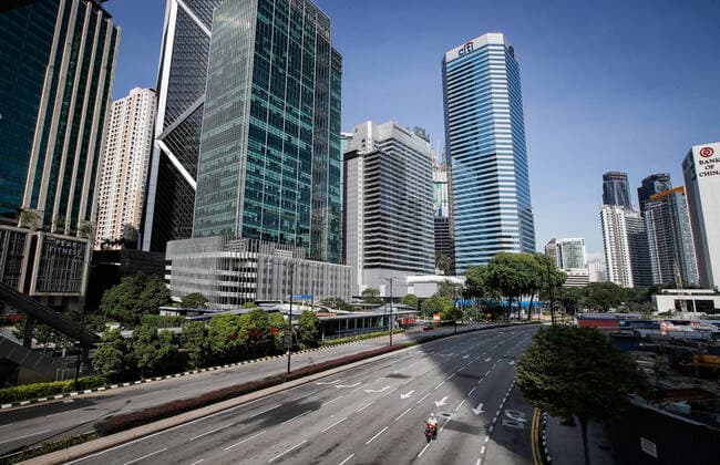June 27, 2021, Kuala Lumpur, Malaysia: A motorcyclist rides along of an empty roads in downtown Kuala Lumpur..Malaysia government announced the one month full lockdown which is due on Monday will be extended due to the daily high number of coronavirus infections cases reported. Kuala Lumpur Malaysia - ZUMAs197 20210627_zaa_s197_076 Copyright: xWongxFokxLoyx