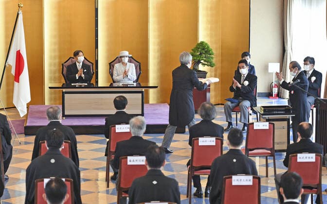 Imperial couple attend Japan Art Academy award ceremony Japanese Emperor Naruhito (L facing camera) and Empress Masako (alongside) attend a Japan Art Academy award ceremony in Tokyo on June 28, 2021. Last year s award ceremony was postponed due to the coronavirus pandemic and held in conjunction with this year s. (Pool photo) 
