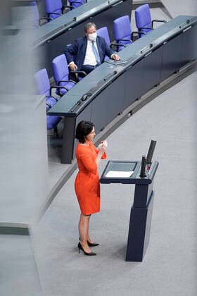 236 Bundestag Session and Debate Current, 24 06 2021, Berlin, Annalena Baerbock Chancellor Candidate Buendnis90 The Greens in portrait during her speech with State Premier Armin Laschet CDU of North Rhine Westphalia and CDU Chairman in the background on the subject of government declaration on the European Council at the 236 session of the German Bundesta