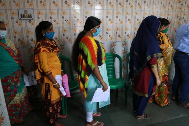 India: Vaccination for sex workers Sex Workers wait in line to get inoculated with the COVID 19 vaccine against the Covid-19 coronavirus, at a vaccination centre Red Light Area in Kolkata on June 28,2021. State Goverment Health Department and Kolkata Municipal corporation organized more than 300 Sex workers vacined today. Kolkata West Bengal India Copyright: DipaxChakraborty