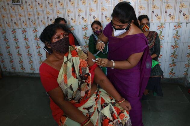 India: Vaccination for sex workers A health worker inoculates a Sex worker person with a dose of the Covishield vaccine against the Covid-19 coronavirus at Red Light area a vaccination centre in Kolkata on June 28,2021. Kolkata West Bengal India Copyright: DipaxChakraborty