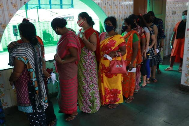 India: Vaccination for sex workers Sex Workers wait in line to get inoculated with the COVID 19 vaccine against the Covid-19 coronavirus, at a vaccination centre Red Light Area in Kolkata on June 28,2021. State Goverment Health Department and Kolkata Municipal corporation organized more than 300 Sex workers vacined today. Kolkata West Bengal India Copyright: DipaxChakraborty