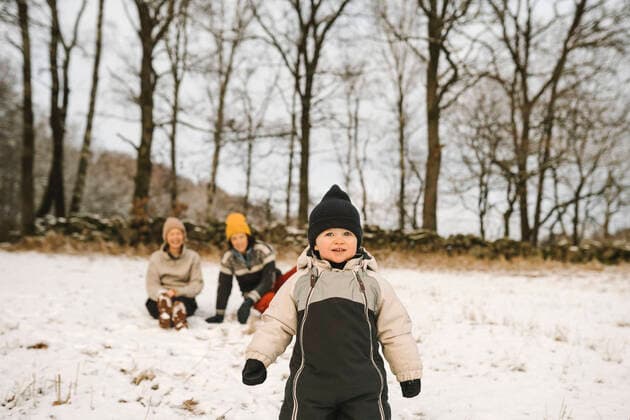 Girl wearing knit hat looking away while standing on snow Sweden, Vastergotland, model released Copyright: xMaskotx , MA87409