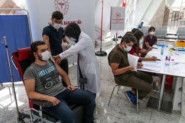 June 28, 2021, Ankara, Turkey: A nurse administers a dose of Biontech vaccine to an individual during the Covid-19 Vaccination operation at Ankara high speed train station..A team affiliated to the Ministry of Health of the Republic of Turkey set up against COVID-19 vaccine stand at the Ankara high speed train station. In Turkey, as of June 25, anyone over the age of 18 can get the Sinovac or Biontech vaccine without an appointment. Ankara Turkey - ZUMAs197 20210628_zaa_s197_105 Copyright: xTunahanxTurhanx