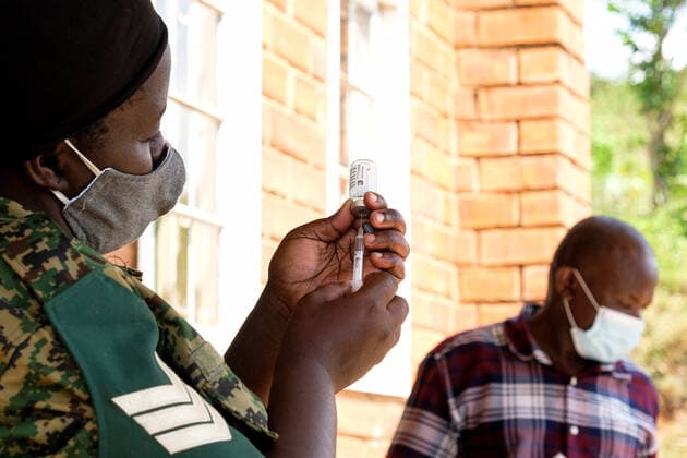 (210628) -- KAMPALA, June 28, 2021 -- A health worker prepares a dose of the COVID-19 vaccine in Kampala, Uganda, on June 28, 2021. Uganda on Monday resumed COVID-19 vaccination for health workers and those due to receive a second AstraZeneca jab after a three-week suspension. (Photo by Hajarah Nalwadda Xinhua) UGANDA-KAMPALA-COVID-19-VACCINATION ZhangxGaiping 