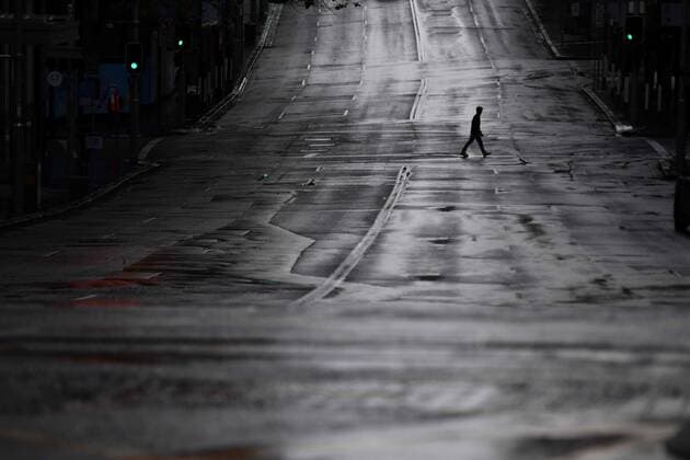 NSW CORONAVIRUS COVID19, A pedestrian crosses an empty Bridge Street in Sydney, Tuesday, June 29, 2021. More than five million people in Greater Sydney and its surrounds have gone into a 14-day lockdown as health authorities try to regain control of a coronavirus outbreak. ( NO ARCHIVING, EDITORIAL USE ONLY, NO USE IN BOOKS WITHOUT CONSENT SYDNEY NSW AUSTRALIA  Copyright: xMICKxTSIKASx 20210629001553442856