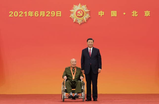 (210629) -- BEIJING, June 29, 2021 -- Chinese President Xi Jinping, also general secretary of the Communist Party of China (CPC) Central Committee and chairman of the Central Military Commission, presents the July 1 Medal, the Party s highest honor, to Wang Zhanshan at the award ceremony at the Great Hall of the People in Beijing, capital of China, June 29, 2021. The award ceremony of the July 1 Medal was held Tuesday morning at the Great Hall of the People in Beijing. ) CHINA-BEIJING-XI JINPING-JULY 1 MEDAL-AWARD CEREMONY (CN) LixXueren 