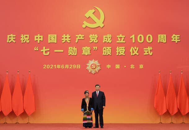 (210629) -- BEIJING, June 29, 2021 -- Chinese President Xi Jinping, also general secretary of the Communist Party of China (CPC) Central Committee and chairman of the Central Military Commission, presents the July 1 Medal, the Party s highest honor, to Zhoigar at the award ceremony at the Great Hall of the People in Beijing, capital of China, June 29, 2021. The award ceremony of the July 1 Medal was held Tuesday morning at the Great Hall of the People in Beijing. ) CHINA-BEIJING-XI JINPING-JULY 1 MEDAL-AWARD CEREMONY (CN) LixXueren 