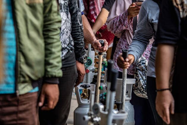 June 30, 2021, Jakarta, Jakarta, Indonesia: Families of COVID-19 patients queue to refill oxygen cylinders in the Manggarai area, Jakarta, Wednesday 30 June 2021..The demand for new oxygen cylinders and filling oxygen cylinders has increased drastically following the surge in cases of COVID-19 with a new, deadly variant in Indonesia. Jakarta Indonesia - ZUMAh128 20210630_zap_h128_015 Copyright: xDonalxHusnix